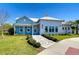 Charming community clubhouse featuring a welcoming entrance and sidewalk at 5325 Thistle Field Ct, Wesley Chapel, FL 33545