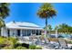 Community clubhouse with lounge chairs by the pool at 5325 Thistle Field Ct, Wesley Chapel, FL 33545
