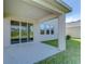 Covered patio with a concrete surface and sliding glass doors overlooking the yard at 5325 Thistle Field Ct, Wesley Chapel, FL 33545