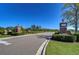 Community entryway with brick pillars and manicured landscaping at 5325 Thistle Field Ct, Wesley Chapel, FL 33545