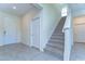 Spacious foyer with tile flooring, staircase, and multiple entryways creating an inviting entrance at 5325 Thistle Field Ct, Wesley Chapel, FL 33545