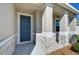Close-up of the front entrance, showcasing stone accents and stylish design details at 5325 Thistle Field Ct, Wesley Chapel, FL 33545