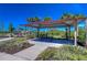 Enjoy a picnic at this pavilion surrounded by beautiful trees and lush landscaping with plenty of space at 5325 Thistle Field Ct, Wesley Chapel, FL 33545