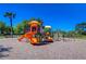 Colorful community playground featuring slides, climbing structures, and ample space for recreational activities at 5325 Thistle Field Ct, Wesley Chapel, FL 33545