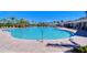 This is a large community pool with clear blue water, a paved deck, and lounge chairs at 5325 Thistle Field Ct, Wesley Chapel, FL 33545