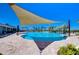 Stunning community pool featuring sun shades, providing a refreshing oasis for residents at 5325 Thistle Field Ct, Wesley Chapel, FL 33545