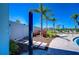 Outdoor pool shower is surrounded by lush tropical landscaping with beautiful plants and flowers at 5325 Thistle Field Ct, Wesley Chapel, FL 33545