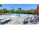 Community splash pad with various water features and lounge chairs at 5325 Thistle Field Ct, Wesley Chapel, FL 33545