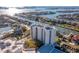 Stunning aerial view of a high-rise condo complex nestled along the waterfront, showcasing its prime location and beautiful surroundings at 5950 Pelican Bay S Plz # 603, Gulfport, FL 33707