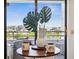 Cozy balcony sitting area with city views, perfect for enjoying morning coffee at 5950 Pelican Bay S Plz # 603, Gulfport, FL 33707