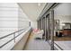 Inviting balcony with comfortable seating and sliding glass doors to the interior at 5950 Pelican Bay S Plz # 603, Gulfport, FL 33707