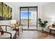 Balcony access from the bedroom features comfortable seating and exterior views of the city at 5950 Pelican Bay S Plz # 603, Gulfport, FL 33707