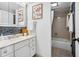 Well-lit bathroom featuring a double vanity, bathtub with shower, and modern fixtures for a functional and stylish space at 5950 Pelican Bay S Plz # 603, Gulfport, FL 33707