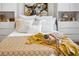 Stylishly decorated bedroom featuring ample pillows and decorative throw blanket at 5950 Pelican Bay S Plz # 603, Gulfport, FL 33707