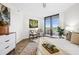 Bedroom with modern furnishings, tiled floor, and a sliding glass door with balcony access at 5950 Pelican Bay S Plz # 603, Gulfport, FL 33707
