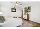 Bright bedroom with white walls and modern decor with attached bath in view at 5950 Pelican Bay S Plz # 603, Gulfport, FL 33707