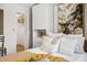 Bright bedroom featuring built-in wardrobe with louvered closet doors and shelves for optimal storage at 5950 Pelican Bay S Plz # 603, Gulfport, FL 33707