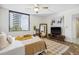 This bright bedroom features a large window, modern decor, and stylish furniture at 5950 Pelican Bay S Plz # 603, Gulfport, FL 33707