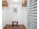 Walk-in closet featuring wire shelving, a mirror, and a small stool at 5950 Pelican Bay S Plz # 603, Gulfport, FL 33707