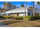 Clubhouse nestled among mature trees and landscaped grounds, creating an inviting community space at 5950 Pelican Bay S Plz # 603, Gulfport, FL 33707