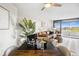 Dining area open to the living room with seating and access to a balcony with a stunning view at 5950 Pelican Bay S Plz # 603, Gulfport, FL 33707