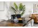 Bright dining area featuring a large table, decor, and a view of the cozy living room at 5950 Pelican Bay S Plz # 603, Gulfport, FL 33707