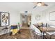 Bright dining area features modern furnishings and decor, with view into hallway at 5950 Pelican Bay S Plz # 603, Gulfport, FL 33707