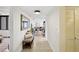 Light-filled condo hallway with tiled floors, leading to a cozy living space with stylish decor at 5950 Pelican Bay S Plz # 603, Gulfport, FL 33707