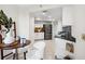Kitchen area with white cabinets, stainless steel appliances, and dining area at 5950 Pelican Bay S Plz # 603, Gulfport, FL 33707