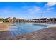 Resort-style pool area with cabanas, sun loungers, and a clear blue swimming pool for relaxation and enjoyment at 5950 Pelican Bay S Plz # 603, Gulfport, FL 33707