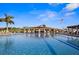 Resort-style swimming pool with comfortable lounge chairs and shaded seating areas at 5950 Pelican Bay S Plz # 603, Gulfport, FL 33707
