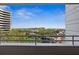 Balcony view overlooking lush greenery and a serene lake at 5950 Pelican Bay S Plz # 603, Gulfport, FL 33707