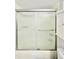 Bathroom shower featuring sliding glass door and built in cabinet at 601 N Keene Rd # P9, Clearwater, FL 33755
