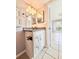 Bathroom vanity with granite countertops, white cabinets, and modern lighting at 601 N Keene Rd # P9, Clearwater, FL 33755