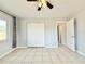 Bedroom featuring tile flooring, ceiling fan, closet and neutral paint at 601 N Keene Rd # P9, Clearwater, FL 33755