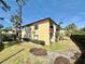A charming two-story apartment building with well-maintained landscaping and a walkway at 601 N Keene Rd # P9, Clearwater, FL 33755