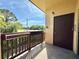 Exterior view of the condo featuring a private balcony overlooking a landscaped area at 601 N Keene Rd # P9, Clearwater, FL 33755
