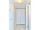 Hallway featuring closet with white bi-fold doors and tile flooring at 601 N Keene Rd # P9, Clearwater, FL 33755