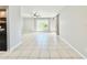 Bright living room featuring tile flooring, a ceiling fan, and natural light at 601 N Keene Rd # P9, Clearwater, FL 33755