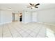 A spacious living room boasts bright tile flooring, and neutral walls at 601 N Keene Rd # P9, Clearwater, FL 33755