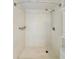 A clean and well-maintained standing shower featuring a shower head and built in shelves at 601 N Keene Rd # P9, Clearwater, FL 33755