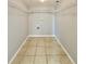Spacious walk-in closet with white wire shelving and neutral tile flooring offering ample storage at 601 N Keene Rd # P9, Clearwater, FL 33755