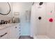 Beautiful bathroom featuring a vanity with a marble countertop and a tiled shower at 6311 Bayside Dr, New Port Richey, FL 34652