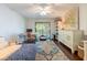 Bedroom featuring wood floors, desk, colorful accents, and a private balcony at 6311 Bayside Dr, New Port Richey, FL 34652