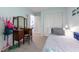 Cozy bedroom featuring a vanity, closet, and doorway to an additional room at 6311 Bayside Dr, New Port Richey, FL 34652