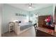 Bright bedroom with a twin bed, stylish decor, and a charming window at 6311 Bayside Dr, New Port Richey, FL 34652