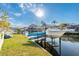 A boat on a lift, with two kayaks stacked beneath at 6311 Bayside Dr, New Port Richey, FL 34652