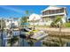 Private dock featuring a boat lift and waterway access, perfect for boating and enjoying waterfront living at 6311 Bayside Dr, New Port Richey, FL 34652