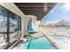 Relaxing balcony features a hanging chair with canal and pool views at 6311 Bayside Dr, New Port Richey, FL 34652