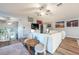 Bright living room with modern decor, wood floors, and comfortable seating area at 6311 Bayside Dr, New Port Richey, FL 34652